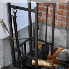 D61. Iron log rack with fireplace tools. 